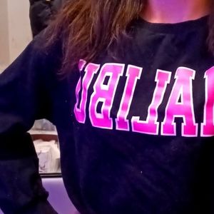 Black hoodie that says MALIBU